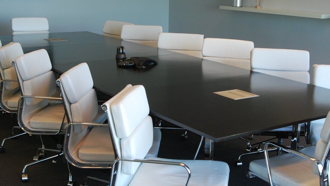 office furniture interior design Denver: black conference table with white leather chairs