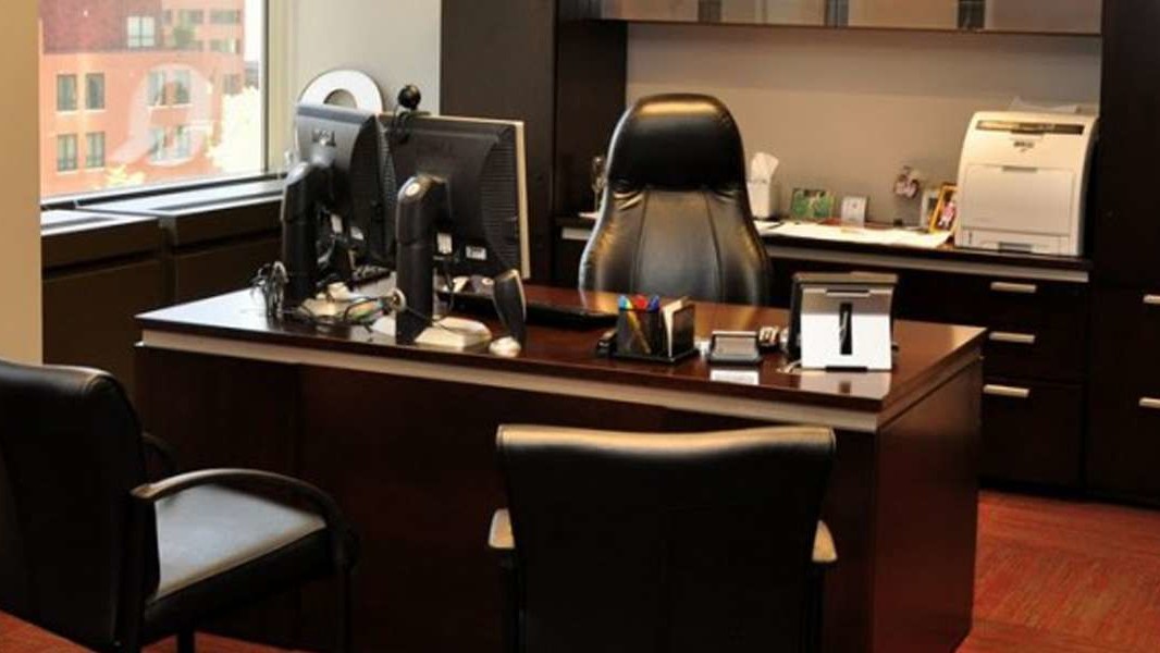 Corporate Office Furniture Design Denver: Quiznos Corporate Headquarters espresso executive desk with black leather chairs