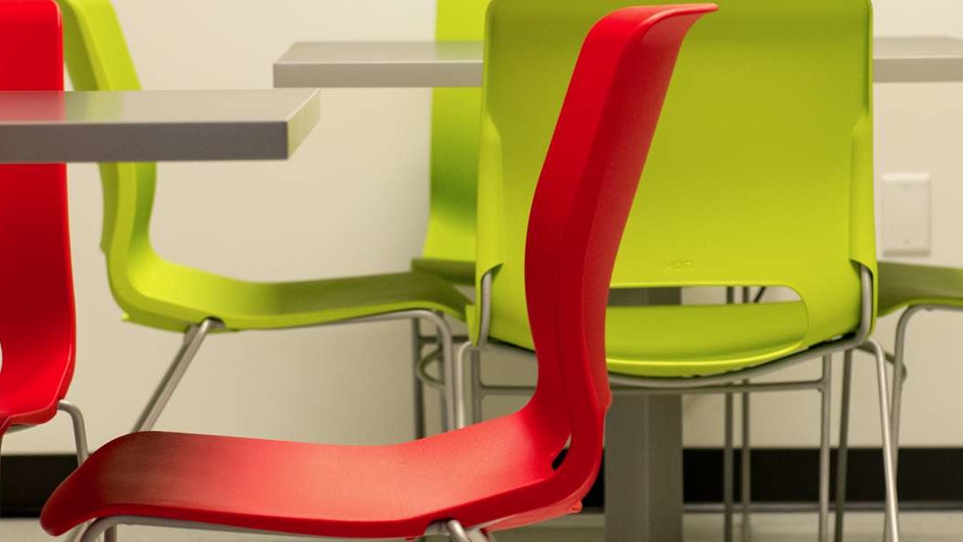 modern office design Denver: red and green break room chairs