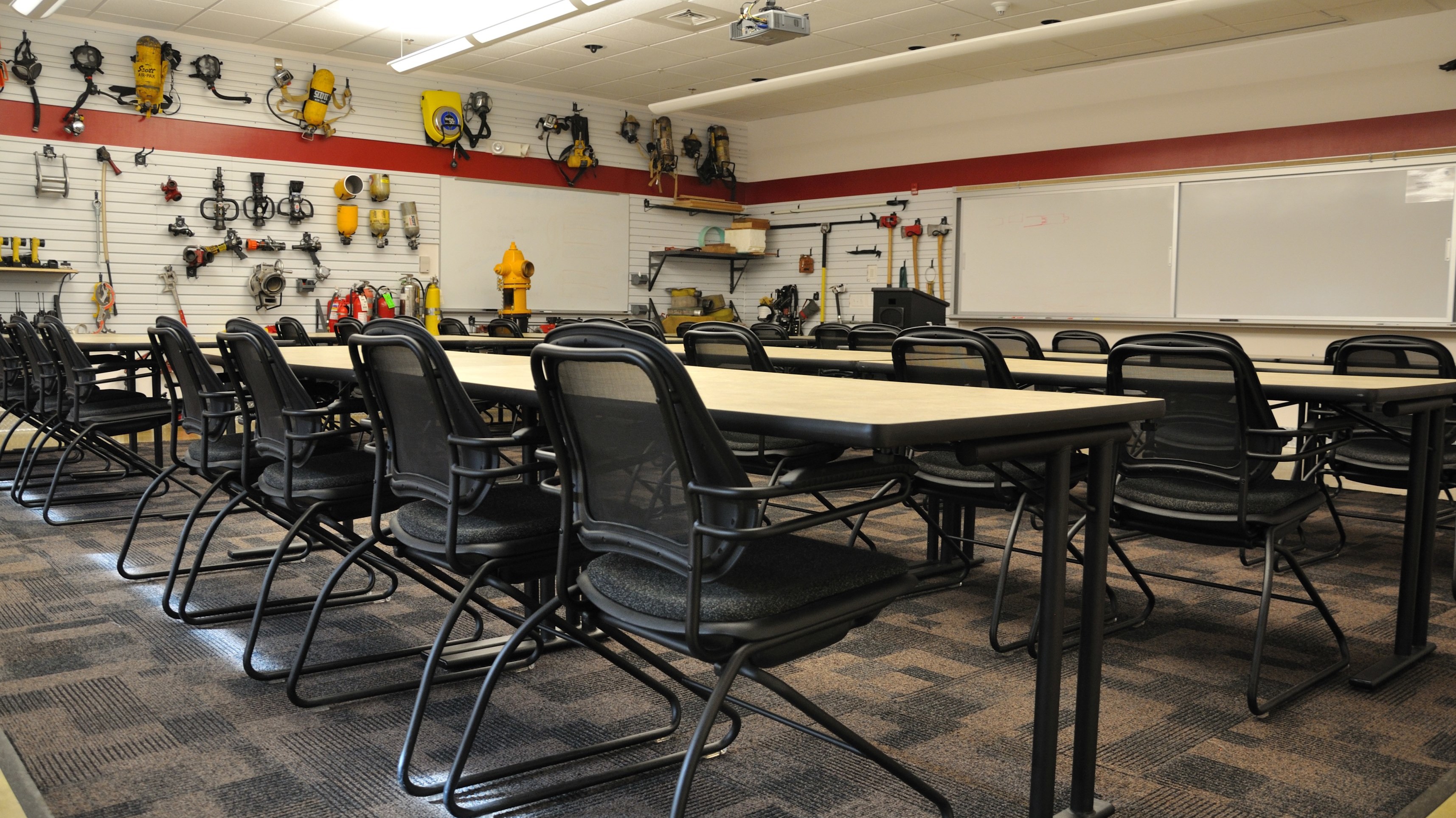 Functional Office Furniture Design: training tables with black chairs