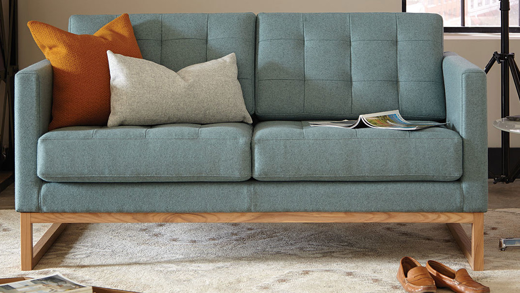 Blue lobby couch with wood trim