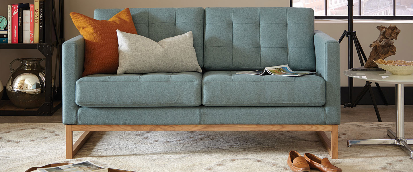 Blue lobby couch with wood trim